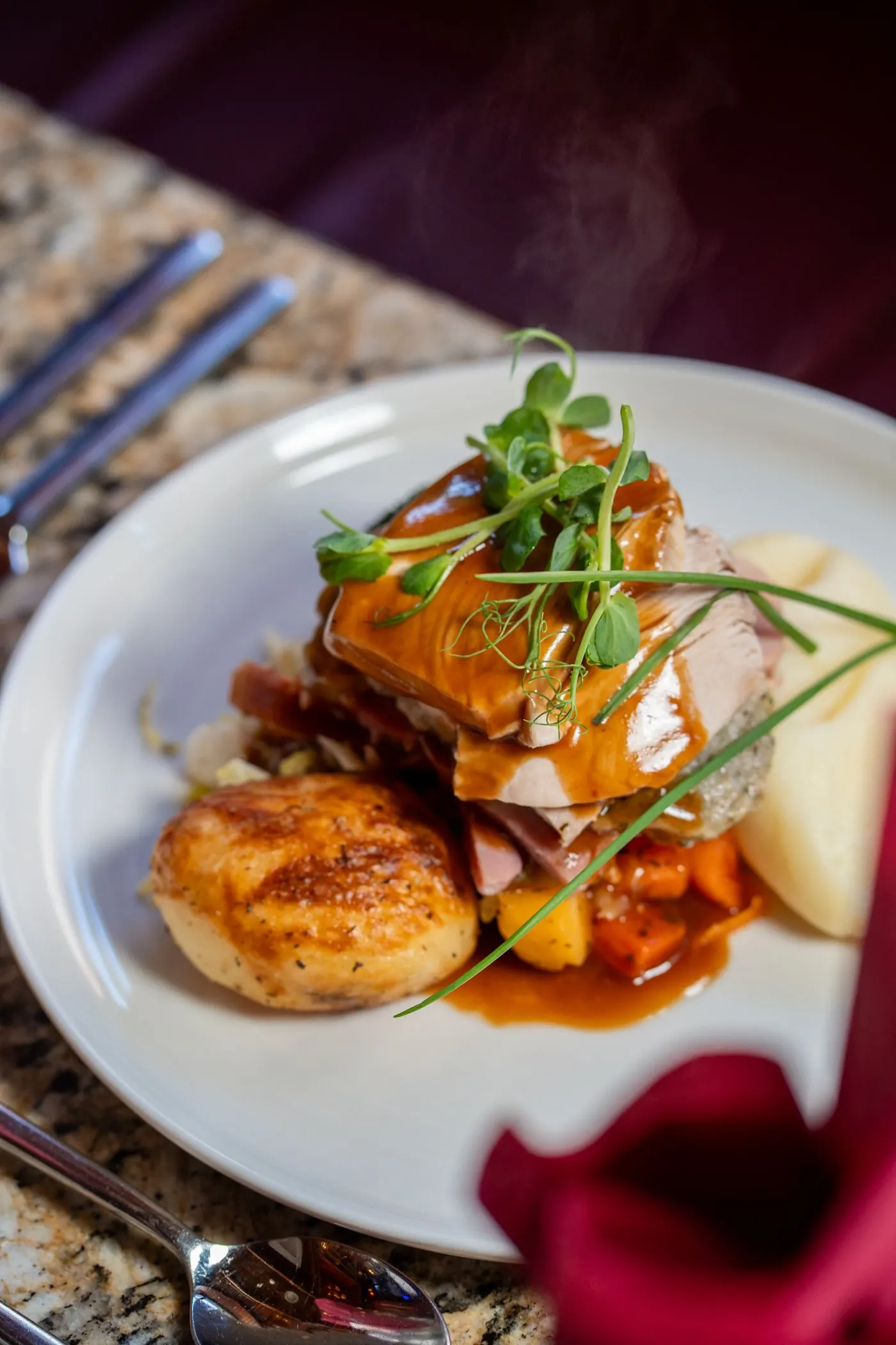 A plated main course with fresh herbs