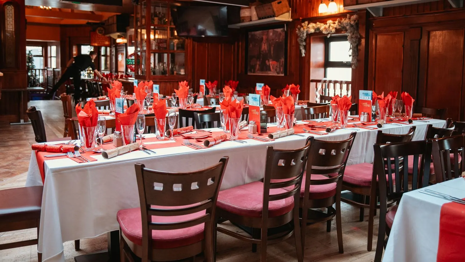 The bar set with long tables for a Christmas party night